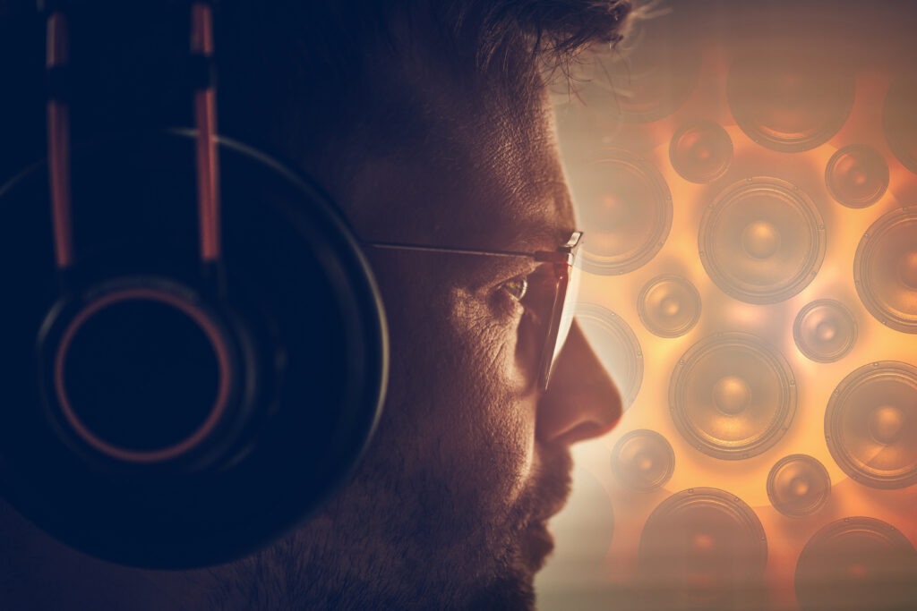 Man wearing headphones illustrating how sound can regulate the nervous system for stress relief