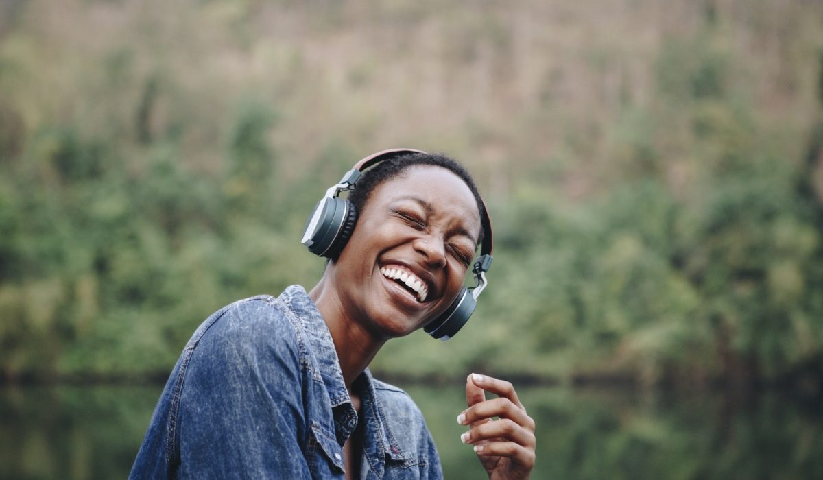 woman-listening-to-music-in-nature-2022-09-16-08-22-00-utc